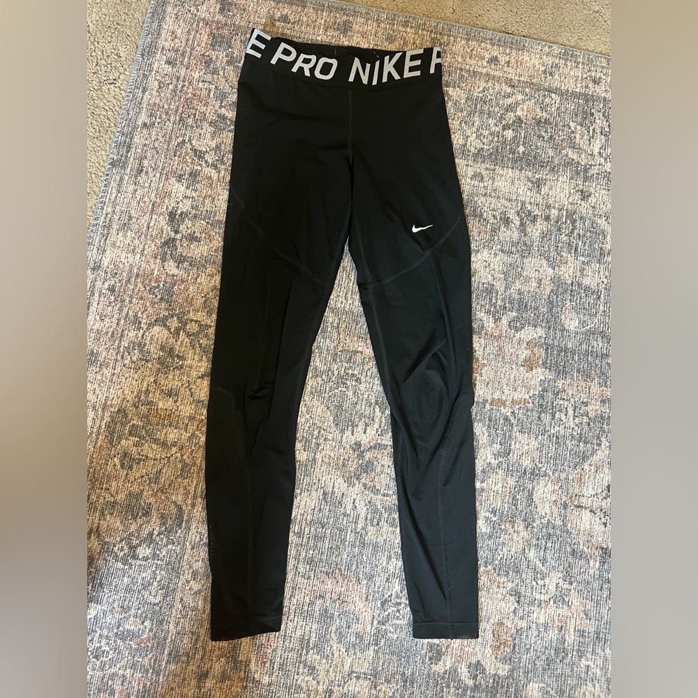 Women’s Black Nike leggings. Size M.